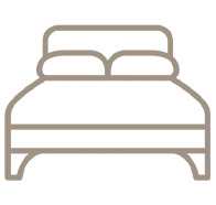 Ícone simples de uma cama com travesseiros.